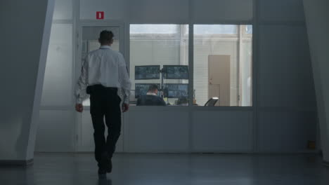 security guard at monitoring desk