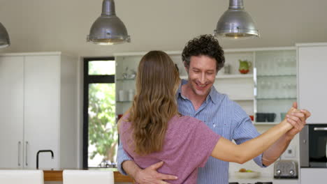 Smiling-couple-dancing-together