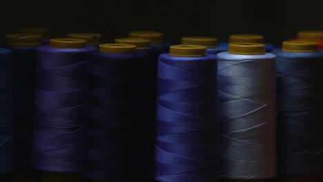 closeup shot of blue cotton thread in shades of blue, used in the textile industry