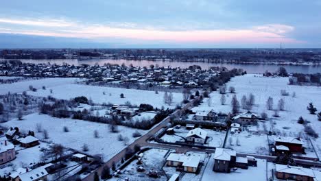Snowy Village Landscape at Sunrise/Sunset
