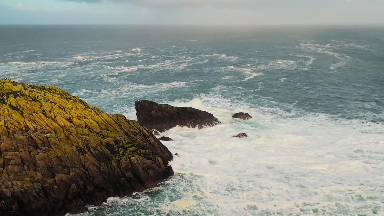 Drone shot of waves and cliffs during an Atlantic storm in Ness on the Hebrides
