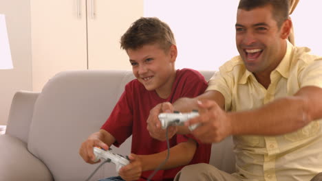 father and son playing video games together