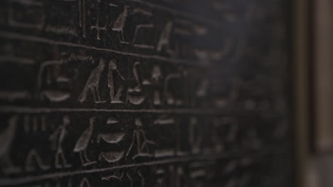 macro close up shot of wall covered in ancient egyptian hieroglyphics