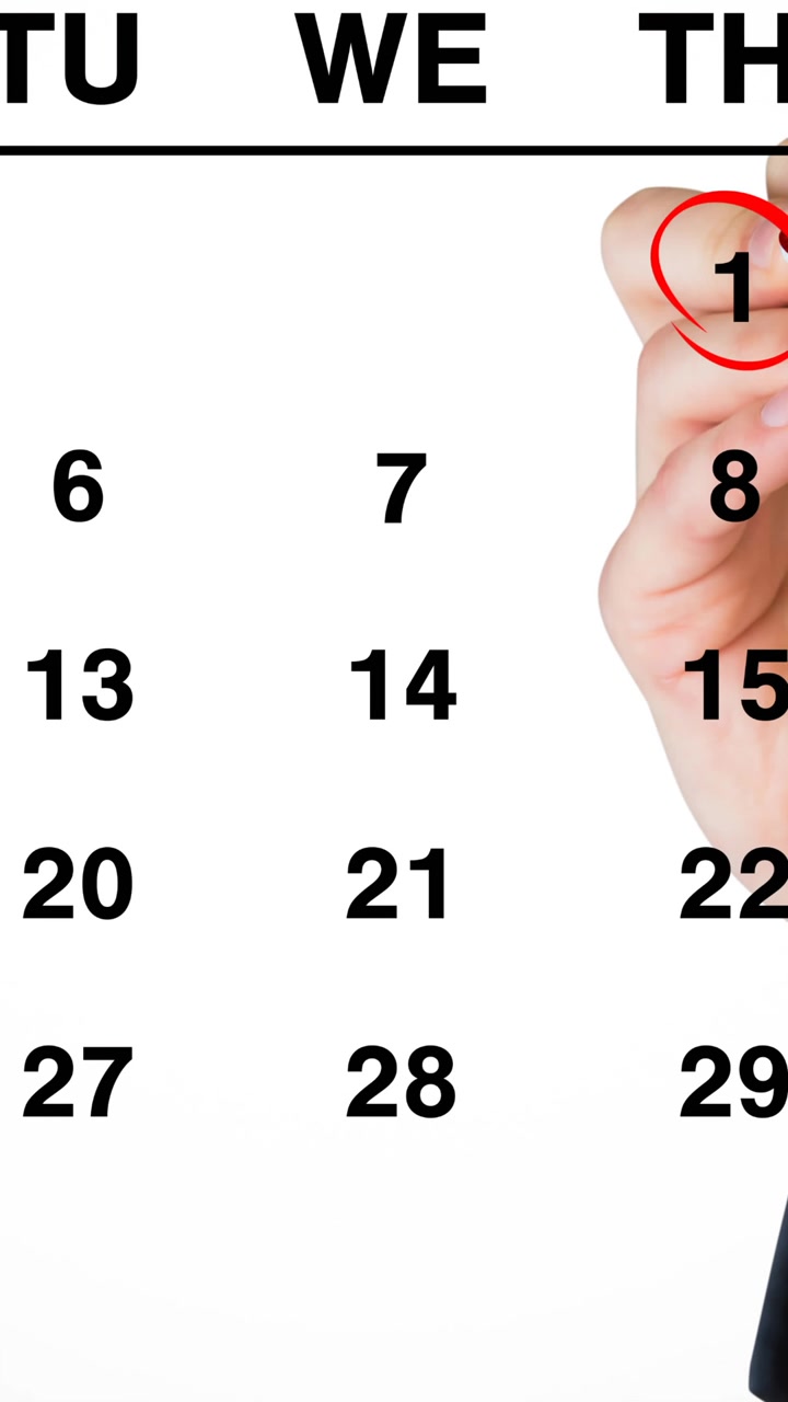 Animation af en hånd, der tegner en rød ring omkring 1. januar på en månedskalender