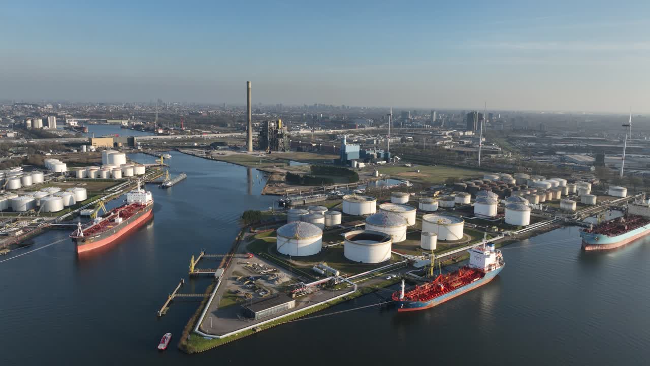 Port of Amsterdam, petroleum storage silos and tanker vessels, aerial view, The Netherlands