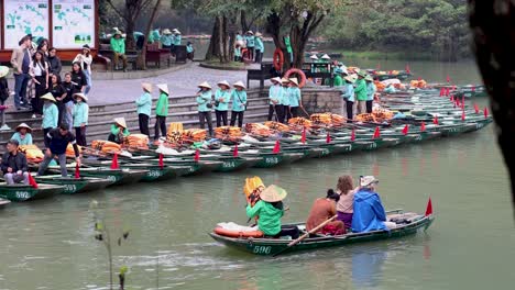 rowers guiding tourists on a tranquil river