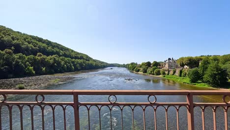 a serene river flowing through lush greenery