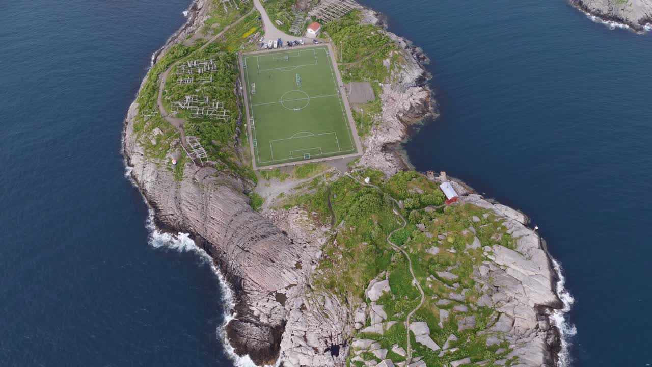 Drone shot of Henningsvaer soccer field in Lofoten Islands in Norway during summer 4k