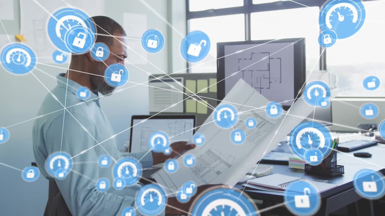 Architect studying plans, monitor showing plan starting blue icons connecting for analyzing plans