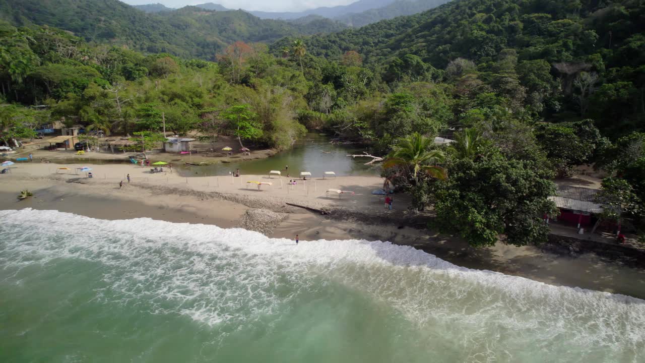 The tranquil shore of osma beach, showcasing lush surroundings and a calm ocean, aerial view