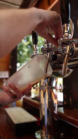 pouring beer at a bar