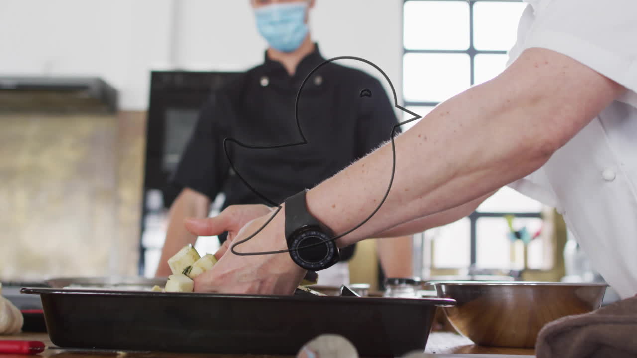 In kitchen, chef preparing dish with glowing animation on cooking surface