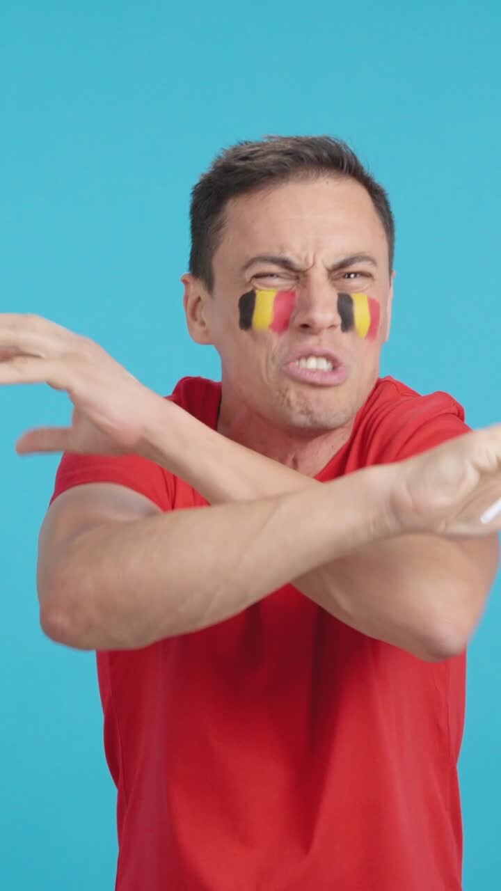 Man Cheering for Belgium, angry with the decision of referee