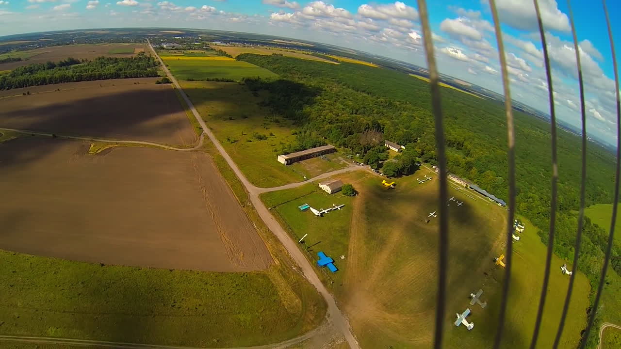 Skydiving and Aerial View of an Airport