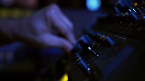 sound engineer working at a mixing desk