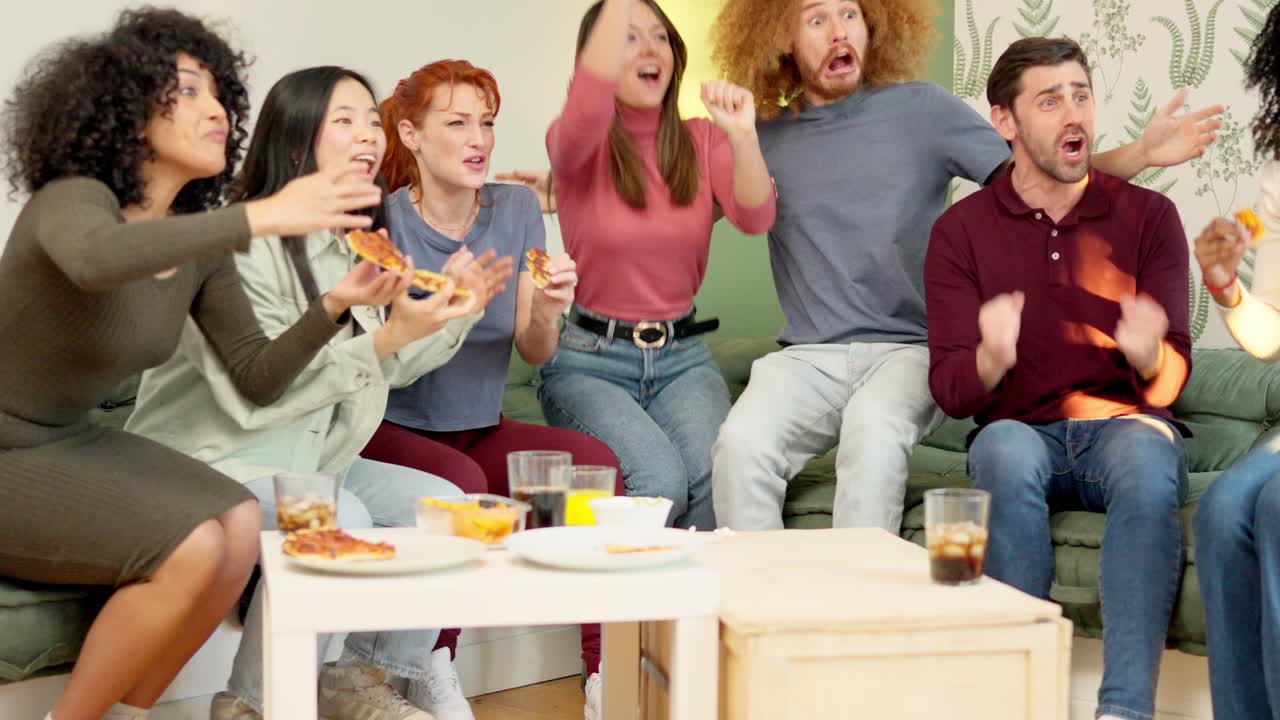 Friends eating pizza and celebrating the victory of their team