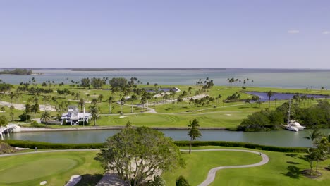 Aerial-view-of-Gasparilla-Golf-Course-next-to-pacific-ocean,-Boca-Grande-Island,-Florida