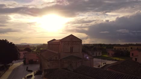 aerial view of old tratalias town with historic church, golden hour, forward