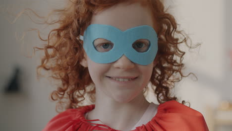 child dressed as superhero