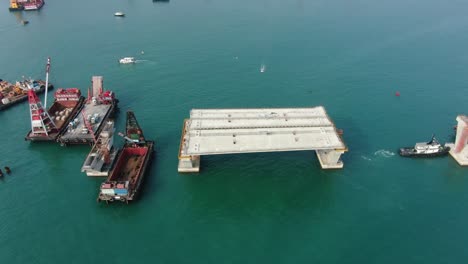 Hong-Kong-cross-bay-link-construction-project,-a-dual-two-lane-bridge-connecting-Tseung-Kwan-O-Lam-Tin-Tunnel-to-Wan-Po-Road,-Aerial-view