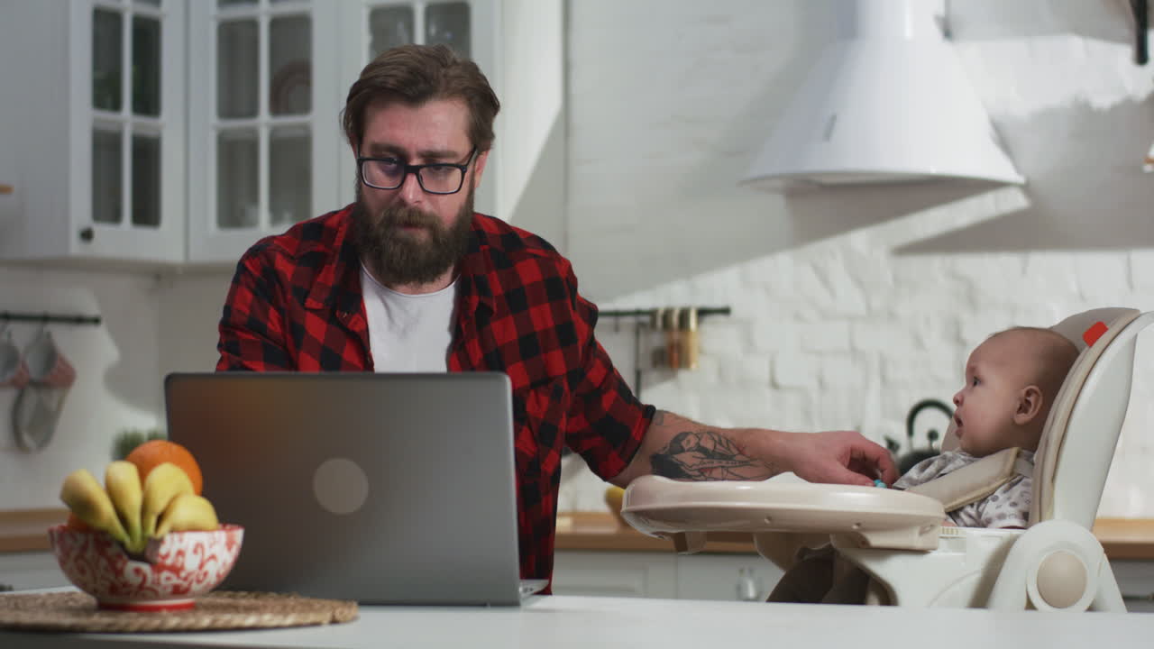 Father Working from Home with Baby | Premium Stock Video Footage