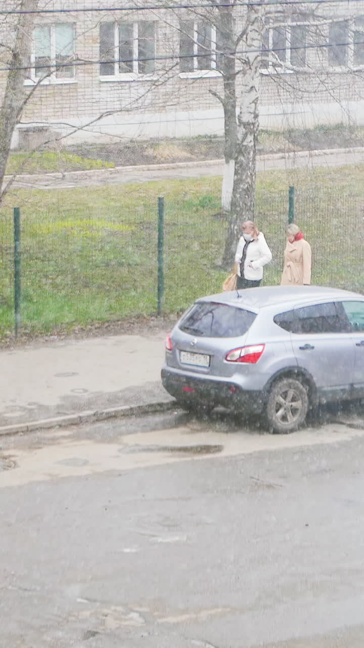People walking on a city street in winter weather