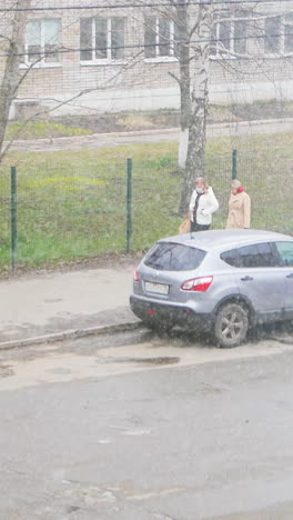 people walking on a city street in winter weather