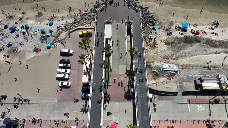 flying over the oceanside ca pier looking straight down and then panning up at the end
