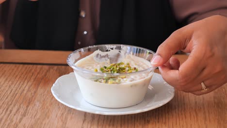 a woman eating a sweet dessert