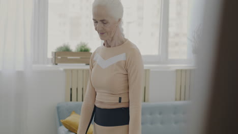 senior woman exercising with resistance bands at home
