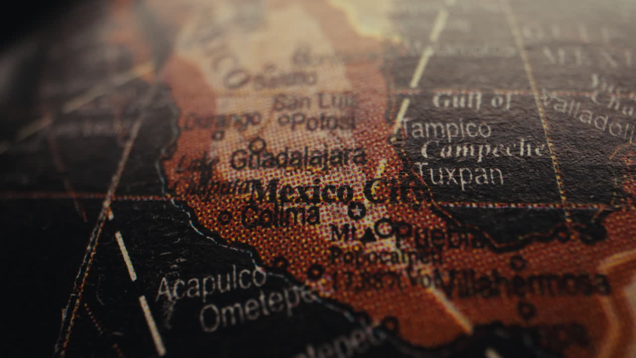 Close-up of a vintage world map, focusing on Mexico