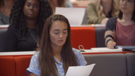 Female-university-students-in-lecture-theatre,-close-up