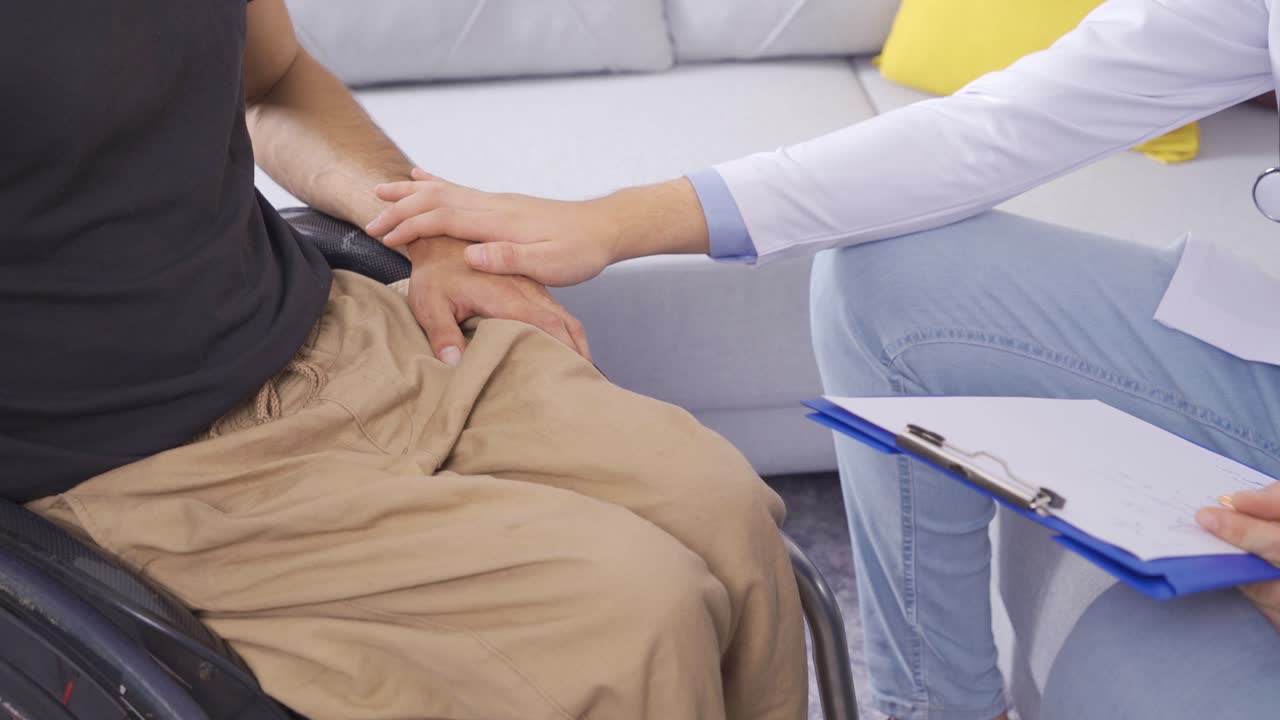 Social Worker, Disabled Male Man In Wheelchair Talks About His Health Problems.