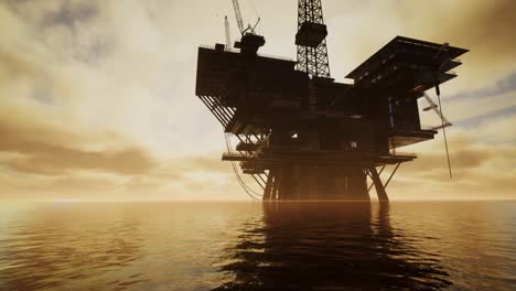 offshore jack up rig in the middle of the sea at sunset time