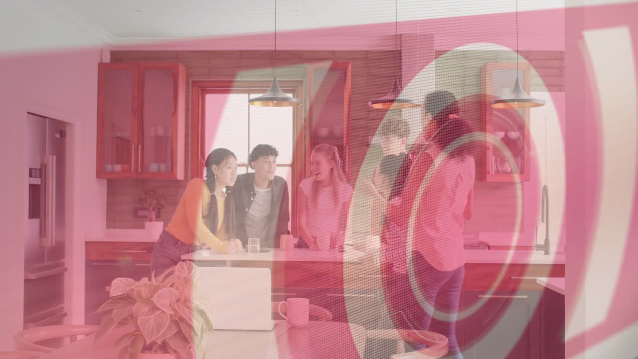 Six adults gathering at island, woman showing phone sharing reveal with tech swirl overlay laughing