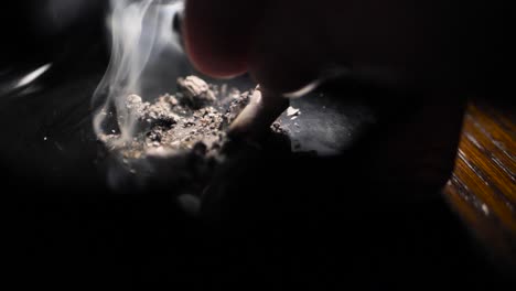 close up smoking cigarette on man hand. slowmotion. scene e