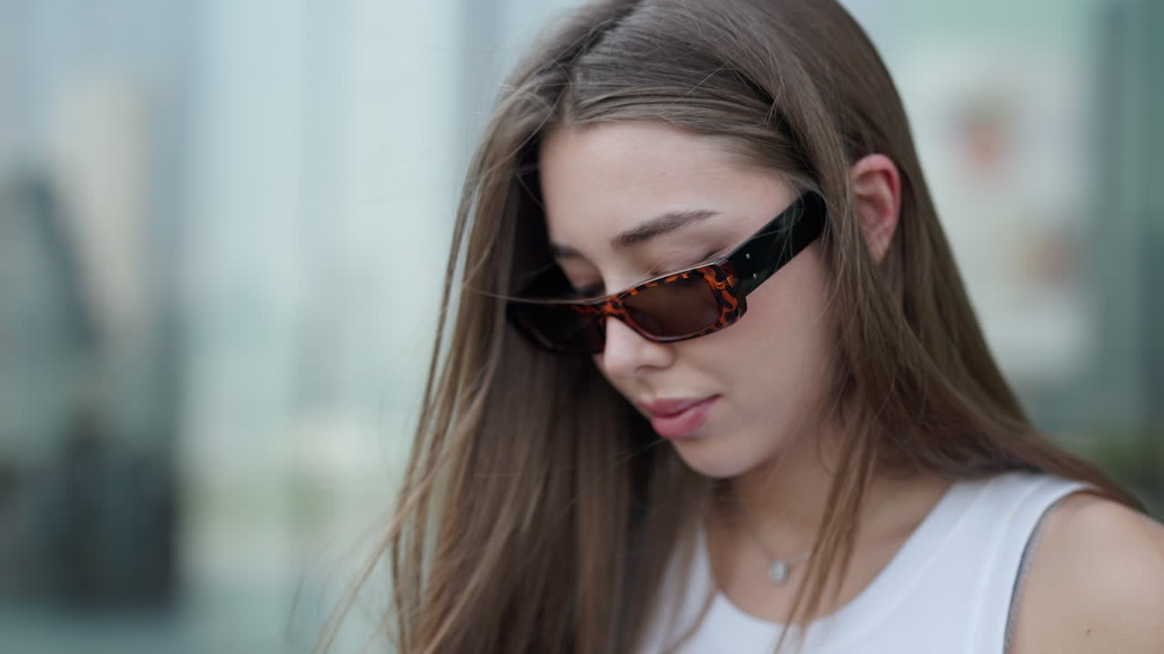 Portrait of a Young Woman with Sunglasses
