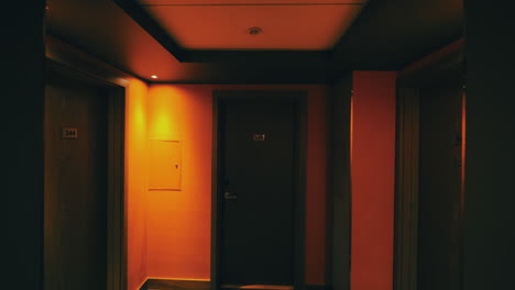 walking to hotel room through dark hallway