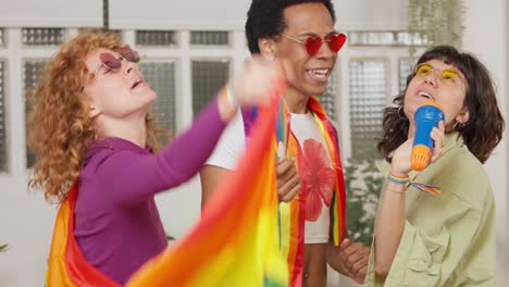 Friends celebrating LGBTQ pride with rainbow flags and music