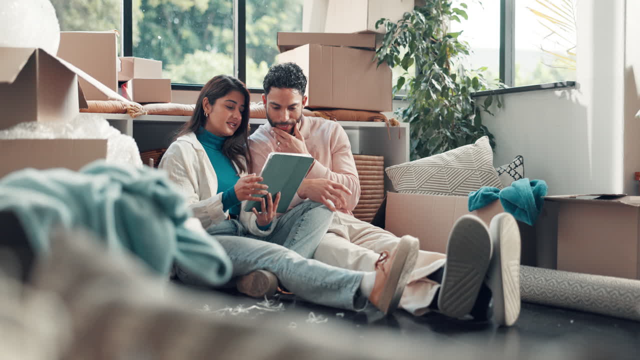 Couple Planning Their Move with Tablet