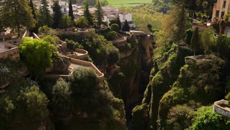 flying towards the old city of ronda over el tajo gorge in spain’s malaga province