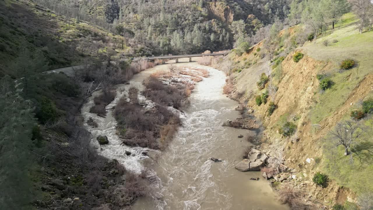 The sweeping drone view showcases Cache Creek’s peaceful yet dynamic movement through the countryside.
