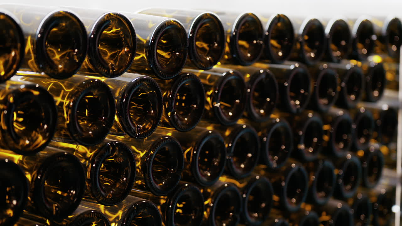 Multiple wine bottles on racks at the Chateau de Cremat winery