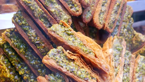 close-up of a stack of pistachio baklava