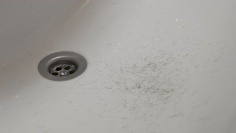 body hair falling in a bathroom sink