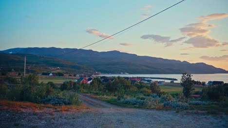 panorama of kokelv village with mountain views at sunrise in norway. - wide shot