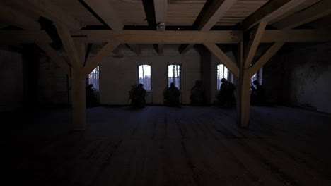 silhouettes of people in an abandoned building