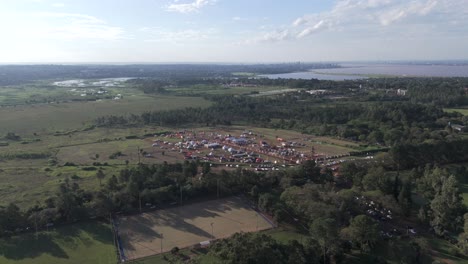 panorama of the argentinian landscape. forest farmers market in the middle of nature preparing for sale. aerial view
