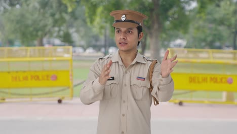 Indian-police-officer-talking-to-someone