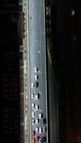 vertical aerial above traffic on the illuminated las vegas blvd, night in usa